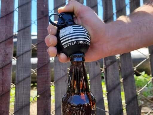 black freedom frag opening a bottle