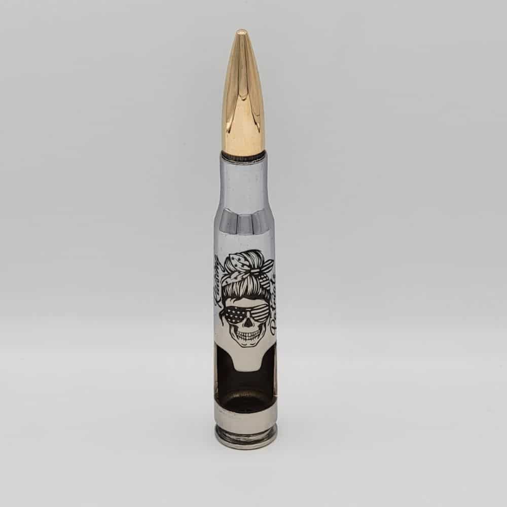 ONCE FIRED .50 CAL BULLET HAND CUT INTO A BOTTLE BREACHER BOTTLE OPENER CHROMED AN DLASER ENGRAVED WITH "RAISING PATRIOTS" AND BREACHER CHICK LOGO THAT IS A SKULL CHICK WITH AMERICANA SUNGLASSES AND HIGH MESSY BUN WITH A FLAG HEADBAND